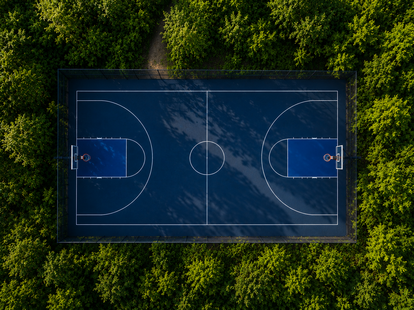 Basketball players competing in an outdoor pickup game